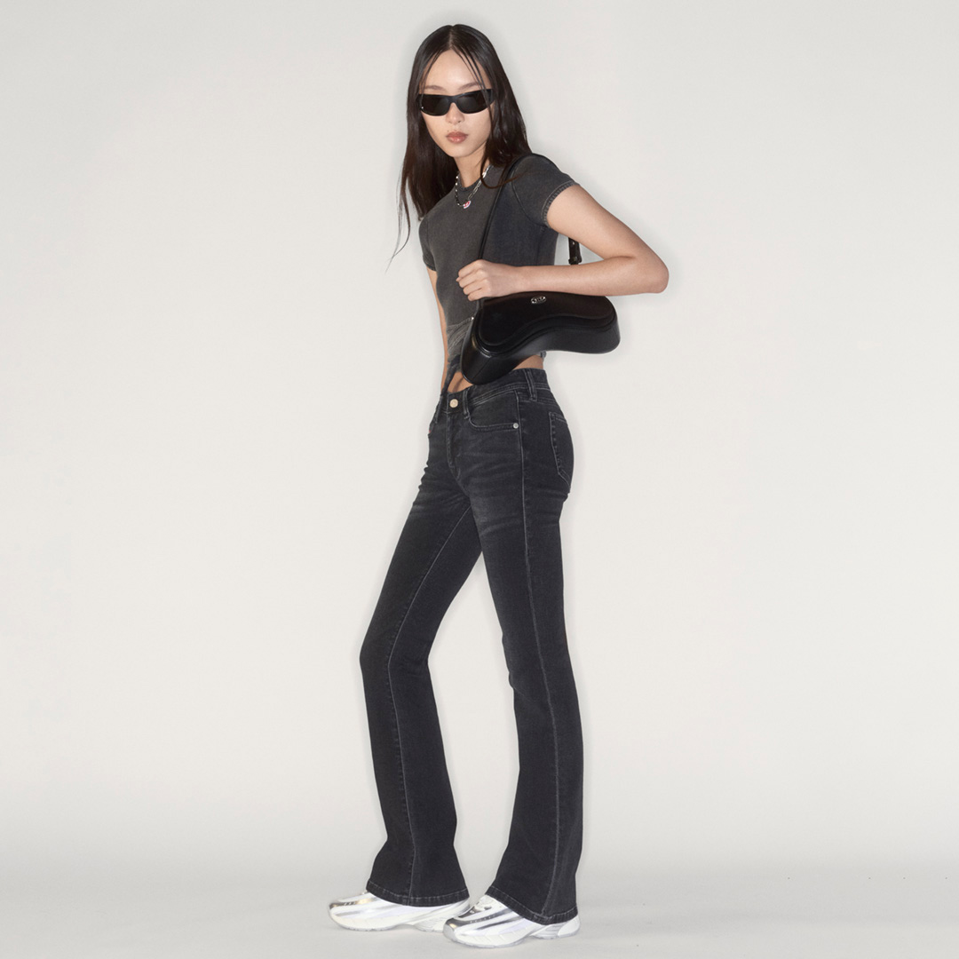 A woman wearing Diesel jeans
